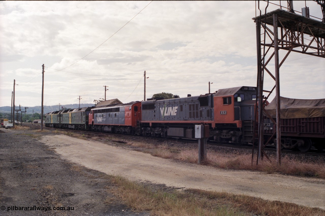 178-18
Ararat, track view looking west as V/Line broad gauge goods train 9169 to Adelaide runs along the mainline behind Australian National BL class locomotives BL 27 Clyde Engineering EMD model JT26C-2SS serial 83-1011 and class leader BL 26 'Bob Hawke' serial 83-1010 and V/Line S class S 313 'Alfred Deakin' Clyde Engineering EMD model A7 serial 61-230 and V/Line X class loco X 53 with serial 75-800 a Clyde Engineering Rosewater SA built EMD model G26C, taken from the former Works and Cattle Sidings area, Ararat A Signal Box roof is visible over the S class.
Keywords: X-class;X53;Clyde-Engineering-Rosewater-SA;EMD;G26C;75-800;