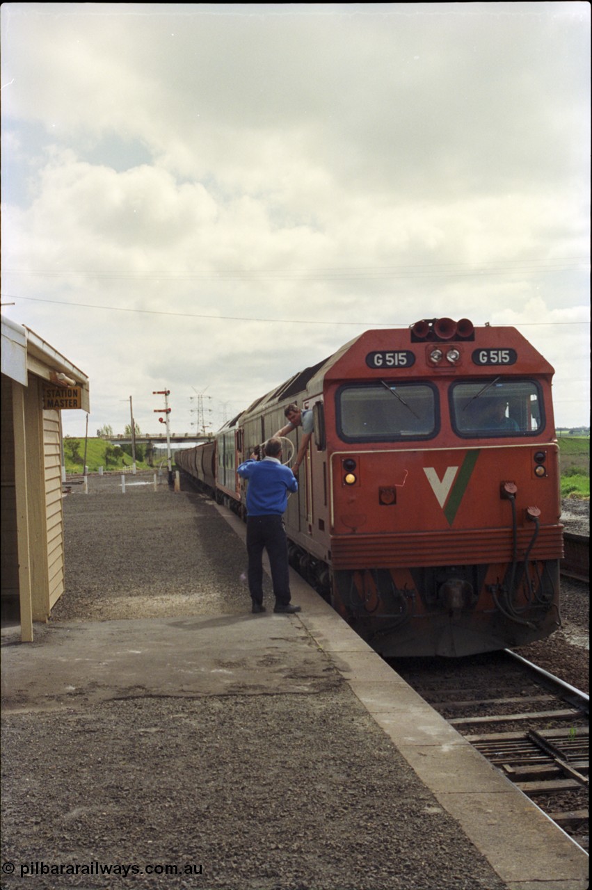 179-10
Gheringhap, V/Line broad gauge G class locomotive G 515 Clyde Engineering EMD model JT26C-2SS serial 85-1243 leads a another G class with up loaded grain train 9122 as the fireman or 2nd person leans out the cab window to swap electric staves with the signaller to continue non-stop to North Geelong gain loop, while Gheringhap is equipped with automatic staff exchange apparatus, they are not used and the G class has no exchanger.
Keywords: G-class;G515;Clyde-Engineering-Rosewater-SA;EMD;JT26C-2SS;85-1243;