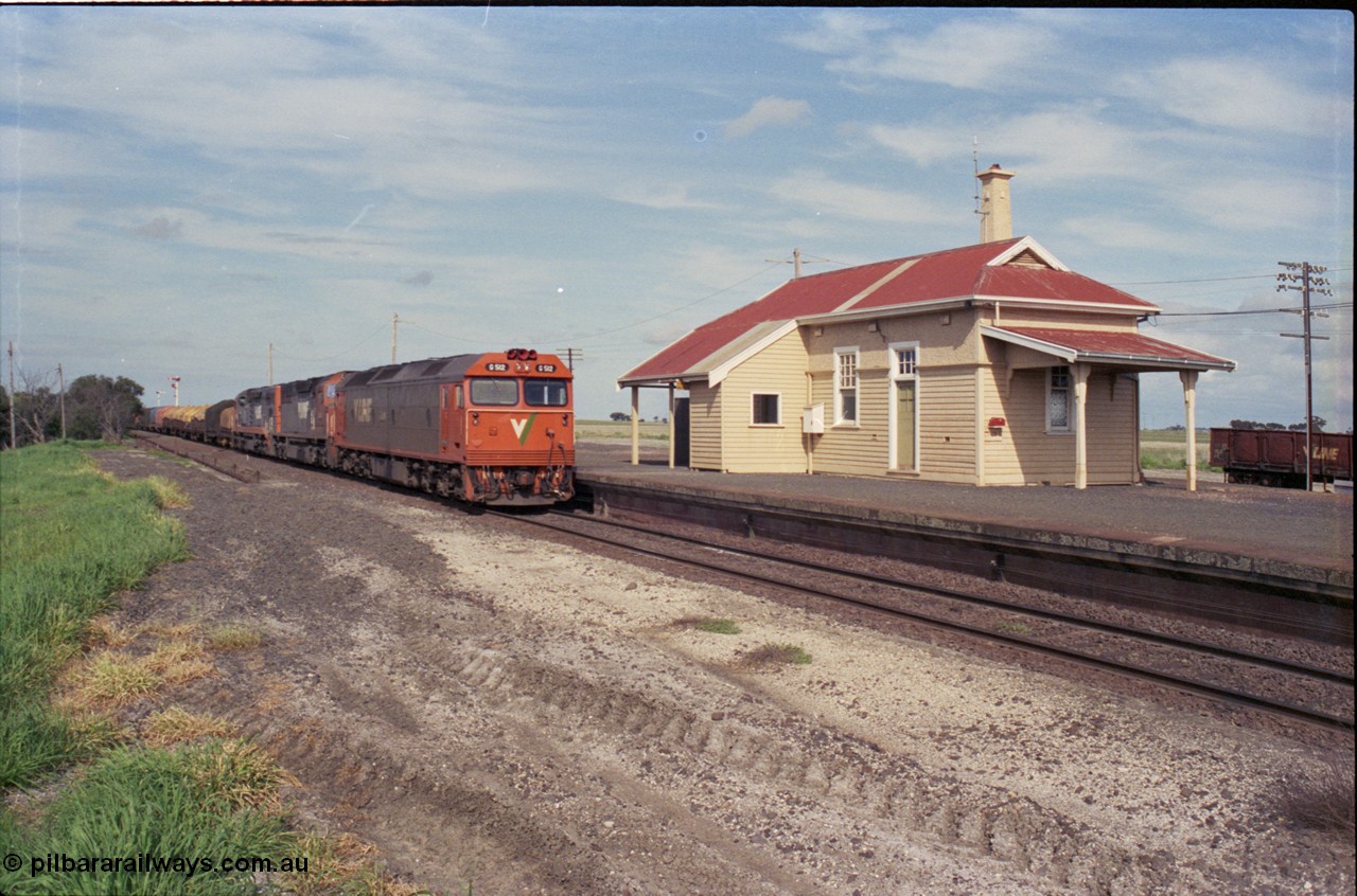 179-17
Gheringhap station overview with V/Line broad gauge goods train 9169 to Adelaide behind G class G 512 Clyde Engineering EMD model JT26C-2SS serial 84-1240 and C classes C 510 Clyde Engineering EMD model GT26C serial 76-833 and C 509 serial 76-832 as they stand at the platform awaiting a train order to continue on towards Ararat on the Maroona line.
Keywords: G-class;G512;Clyde-Engineering-Rosewater-SA;EMD;JT26C-2SS;84-1240;