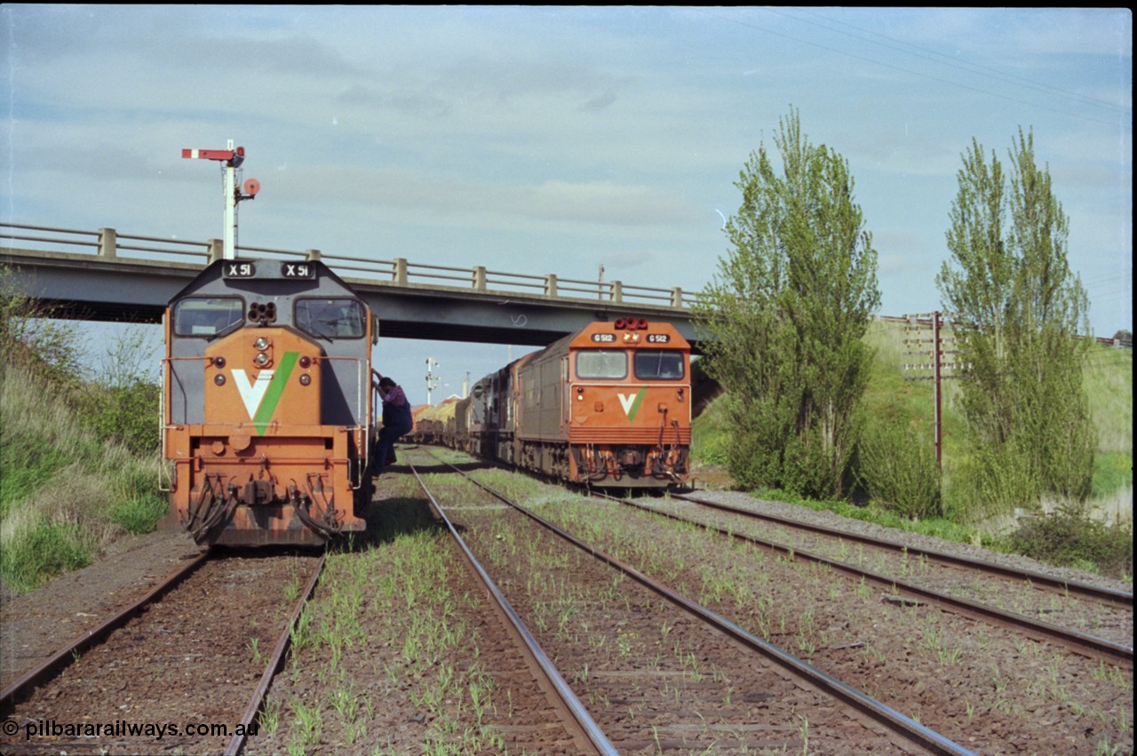 179-23
Gheringhap, V/Line broad gauge goods train 9169 to Adelaide behind G class G 512 Clyde Engineering EMD model JT26C-2SS serial 84-1240 and C classes C 510 Clyde Engineering EMD model GT26C serial 76-833 and C 509 serial 76-832 creeps along the Maroona Line under the Midland Highway overpass as the 2nd person climbs out of X class X 51 Clyde Engineering EMD model G26C serial 75-798 to make his way back onto G 512 and head home to Dimboola.
Keywords: X-class;X51;Clyde-Engineering-Rosewater-SA;EMD;G26C;75-798;