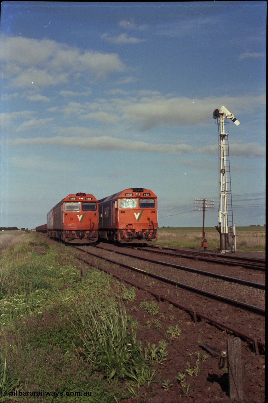 179-34
Gheringhap, track view looking east towards Geelong as broad gauge V/Line light engines G class G 515 Clyde Engineering EMD model JT26C-2SS serial 85-1243 and a sister arrive from North Geelong to recover X 51 pass fellow G class G 521 Clyde Engineering EMD model JT26C-2SS serial 85-1234 locked away with down empty grain train 9121 in Siding A.
Keywords: G-class;G515;Clyde-Engineering-Rosewater-SA;EMD;JT26C-2SS;85-1243;