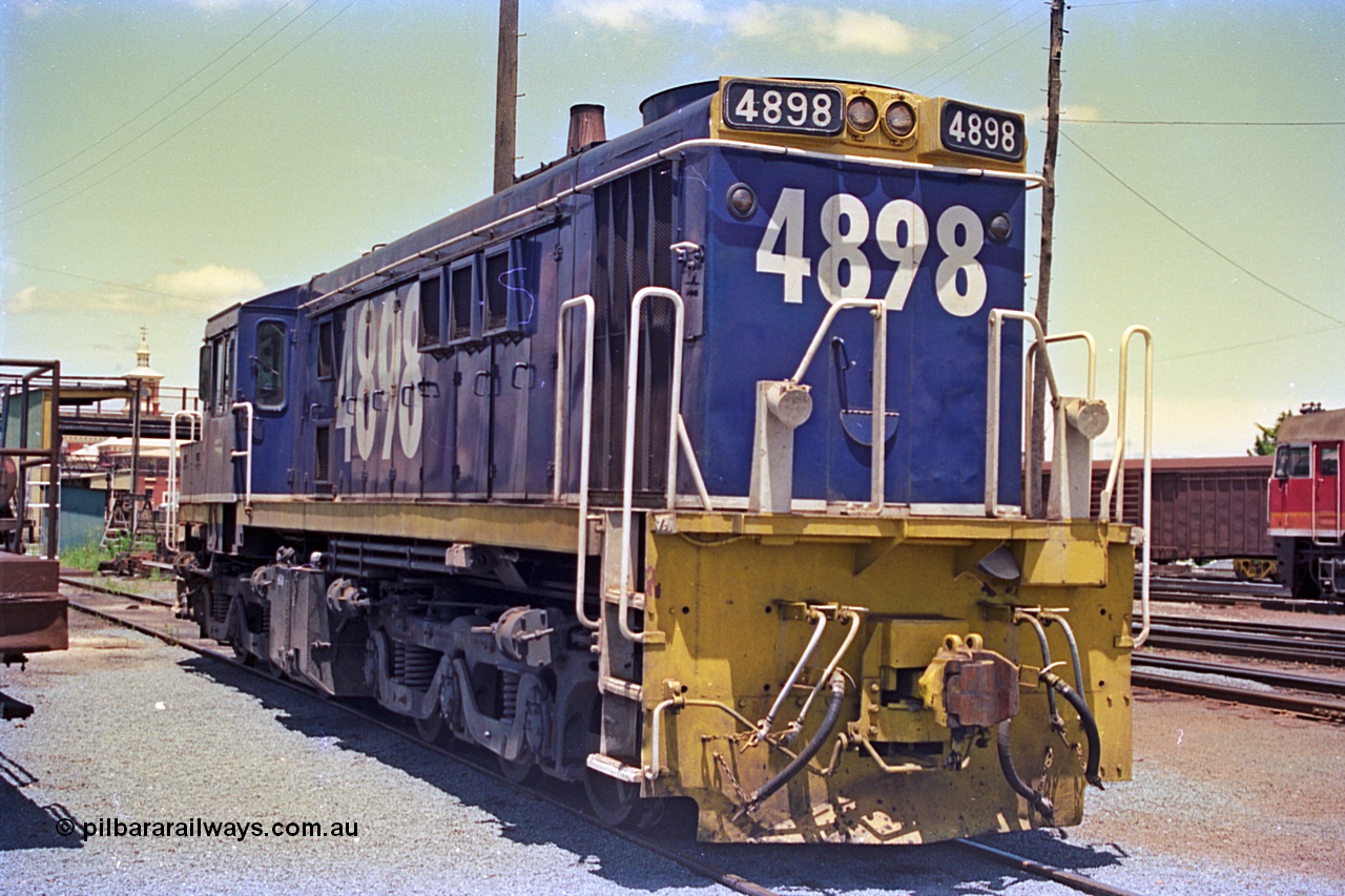 180-23
Albury, NSW, loco depot, NSWSRA standard gauge 48 class locomotive 4898 AE Goodwin ALCo model DL531 serial G3420-13 wearing Freight Rail livery rests near the fuel points.
Keywords: 48-class;4898;AE-Goodwin;ALCo;DL531;G3420-13;
