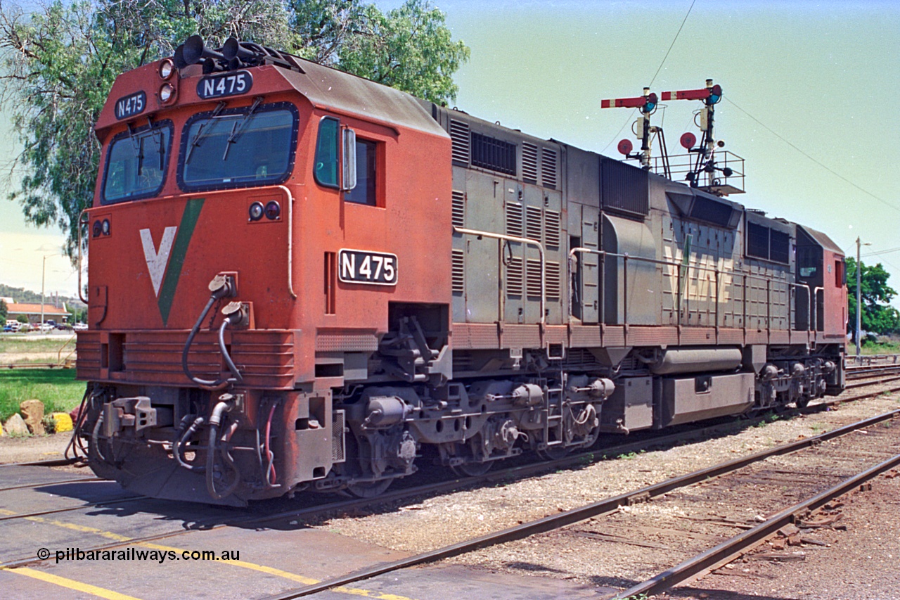 180-24
Wodonga, the last member of V/Line broad gauge N class fleet, N 475 'City of Moe' Clyde Engineering EMD model JT22HC-2 serial 87-1204 stands near the signal box shut down having bought the morning down passenger service from Melbourne.
Keywords: N-class;N475;Clyde-Engineering-Somerton-Victoria;EMD;JT22HC-2;87-1204;