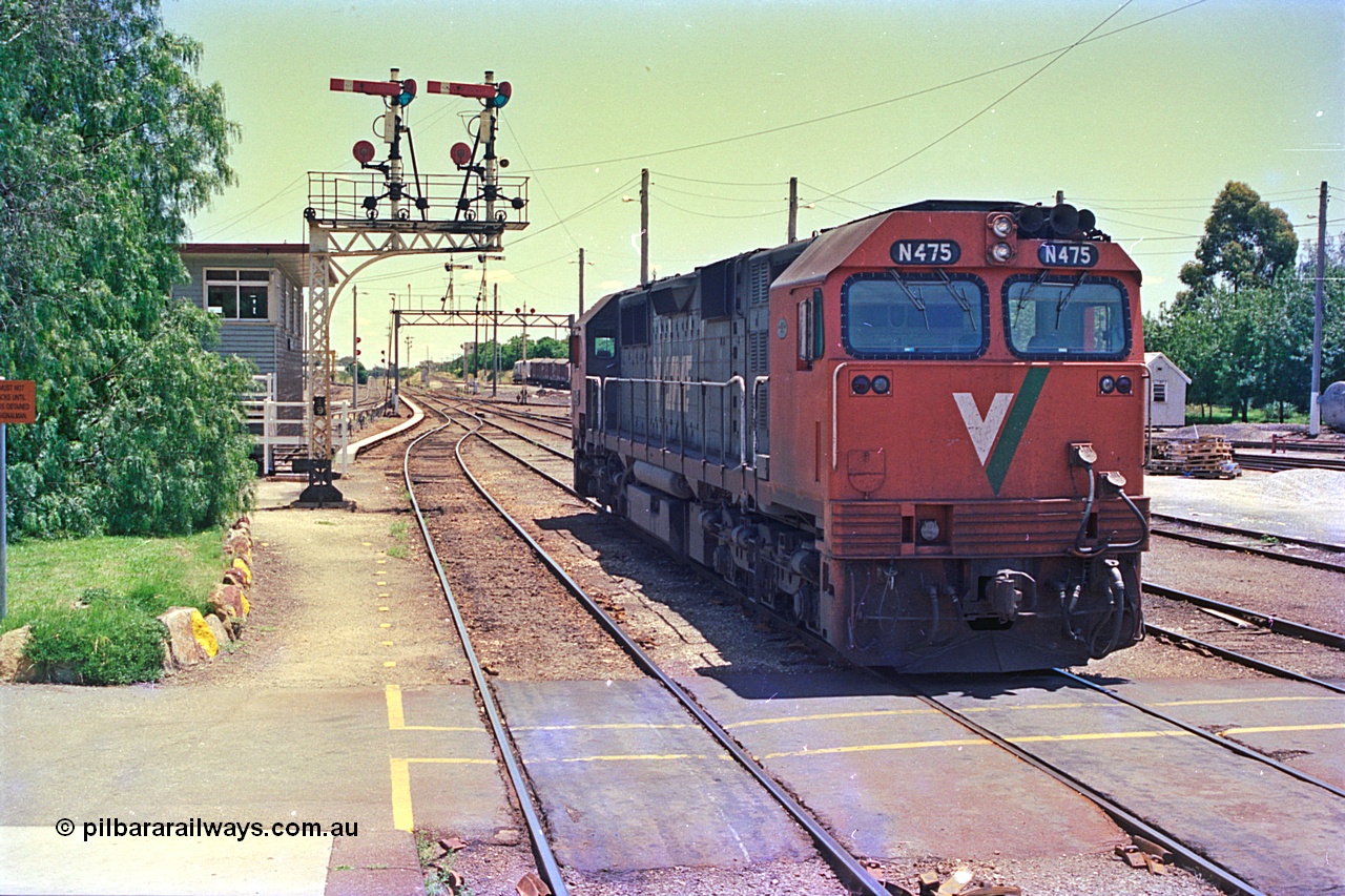 180-37
Wodonga, the last member of V/Line broad gauge N class locomotives N 475 'City of Moe' Clyde Engineering EMD model JT22HC-2 serial 87-1204 stands near the signal box and semaphore signal post No.19 shut down having bought the morning down passenger service from Melbourne.
Keywords: N-class;N475;Clyde-Engineering-Somerton-Victoria;EMD;JT22HC-2;87-1204;