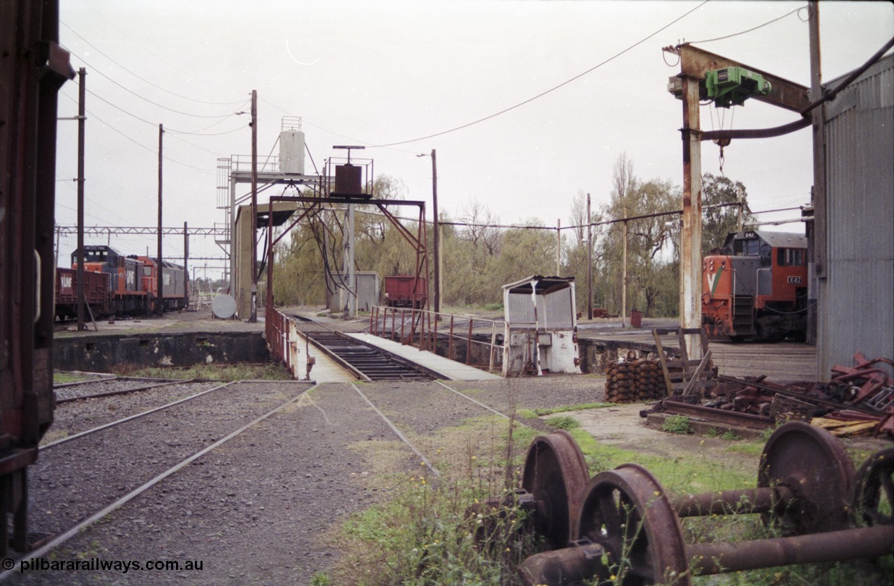 181-20
Traralgon loco depot overview of turntable and pit, fuel point and sanding plant, roundhouse, locos present are T class T 392 Clyde Engineering EMD model G8B serial 65-422, G class G 515 Clyde Engineering EMD model JT26C-2SS serial 85-1243 and X class X 42 Clyde Engineering EMD model G26C serial 70-705, HD type four wheel sand waggon HD 242 in middle of shot.
Keywords: T-class;T392;Clyde-Engineering-Granville-NSW;EMD;G8B;65-422;