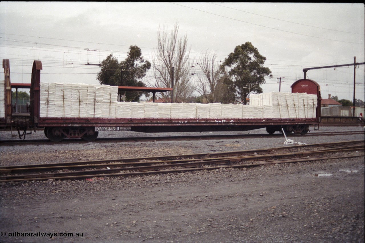181-24
Traralgon yard, broad gauge V/Line VFNX type bogie roll paper waggon VFNX 145 hand brake end with tarpaulin and supports removed, originally built new May 1979 by Victorian Railways Newport Workshops as VFNX 45, but renumbered in the 100 series when the tarpaulin supports were removed in the 1990s.
Keywords: VFNX-type;VFNX145;Victorian-Railways-Newport-WS;VFNX45;