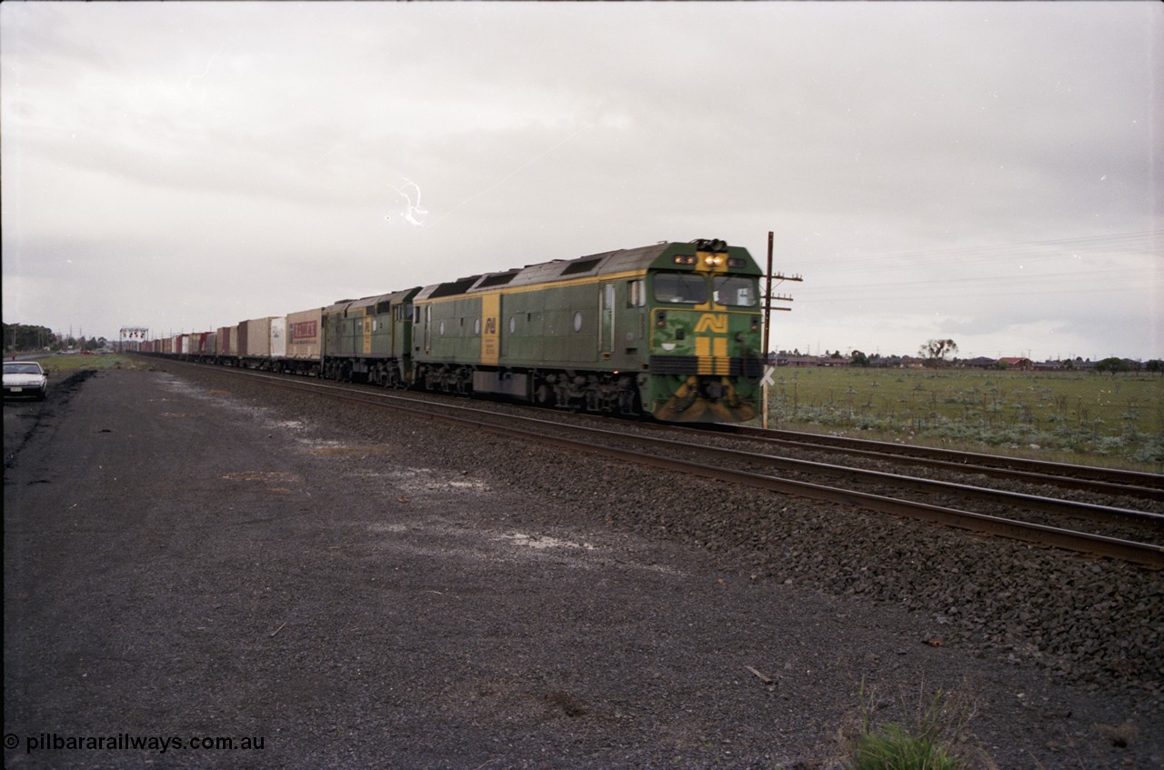 183-02
Deer Park, an Adelaide bound down broad gauge goods train behind Australian National BL class BL 31 Clyde Engineering EMD model JT26C-2SS serial 83-1015 and 700 class 705 AE Goodwin ALCo model DL500G serial G6059-3 crosses Fitzgerald Road.
Keywords: BL-class;BL31;Clyde-Engineering-Rosewater-SA;EMD;JT26C-2SS;83-1015;