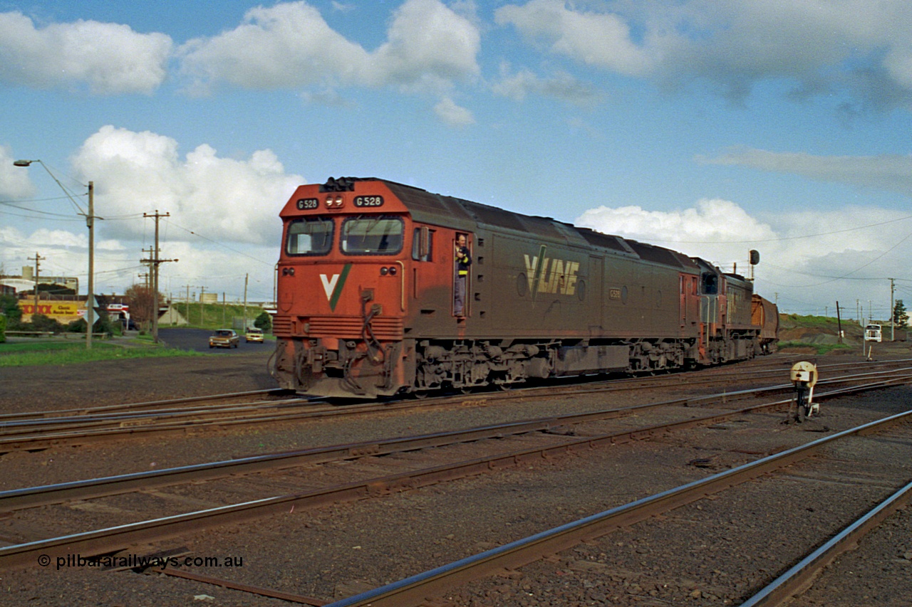 185-25
North Geelong C Box, empty grain train behind G class G 528 Clyde Engineering EMD model JT26C-2SS serial 88-1258 and X class X 41 Clyde Engineering EMD model G26C serial 70-704 as they pass North Geelong C Box, shunter in cab doorway, ground dwarf disc signal 18 in the foreground.
Keywords: G-class;G528;Clyde-Engineering-Somerton-Victoria;EMD;JT26C-2SS;88-1258;