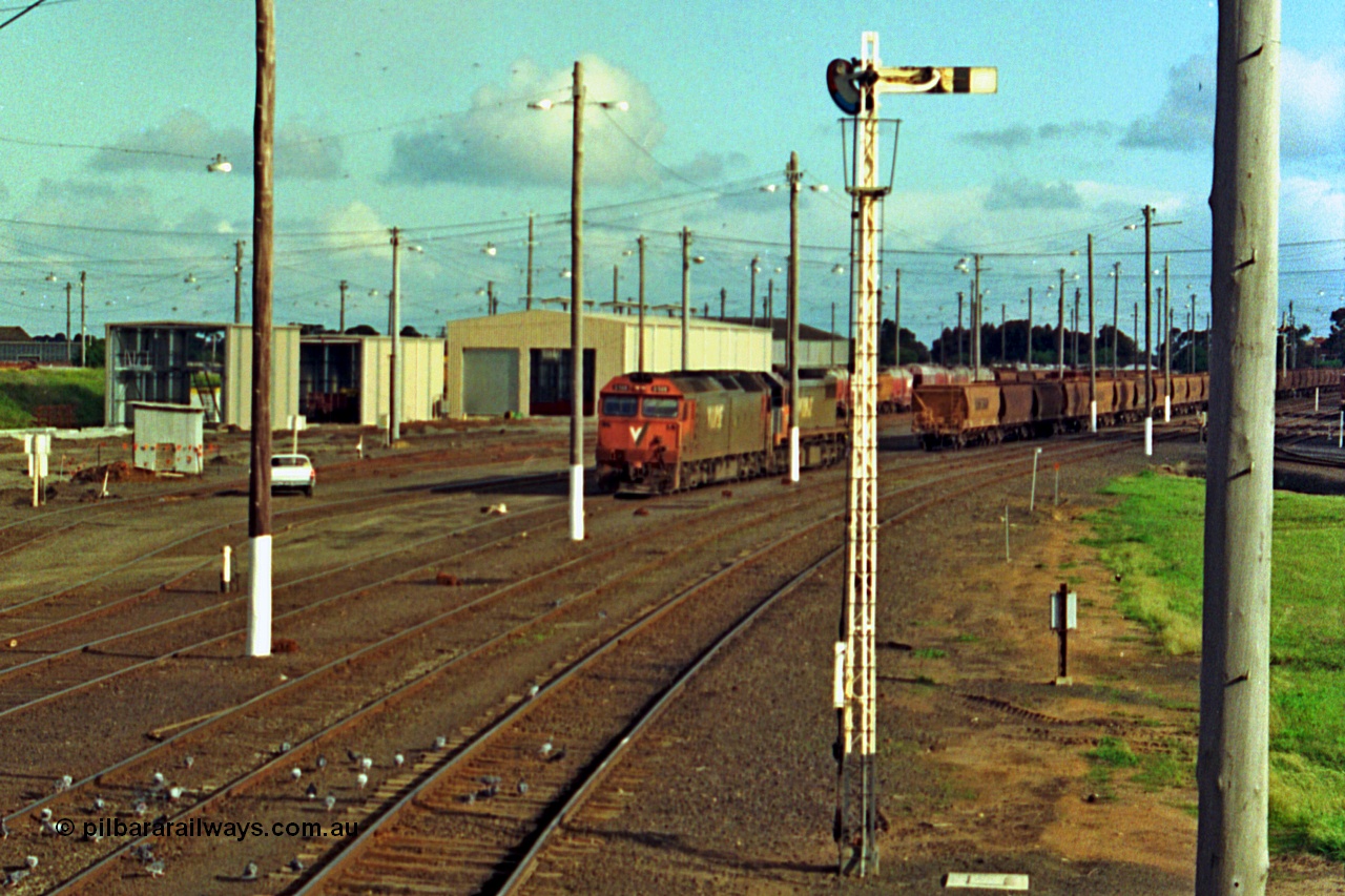 185-28
North Geelong Yard, view from North Geelong C Signal Box of light engines G class G 528 Clyde Engineering EMD model JT26C-2SS serial 88-1258 and X class X 41 Clyde Engineering EMD model G26C serial 70-704 having cut off the empty grain train consist which will form 9125 down empty grain.
Keywords: G-class;G528;Clyde-Engineering-Somerton-Victoria;EMD;JT26C-2SS;88-1258;