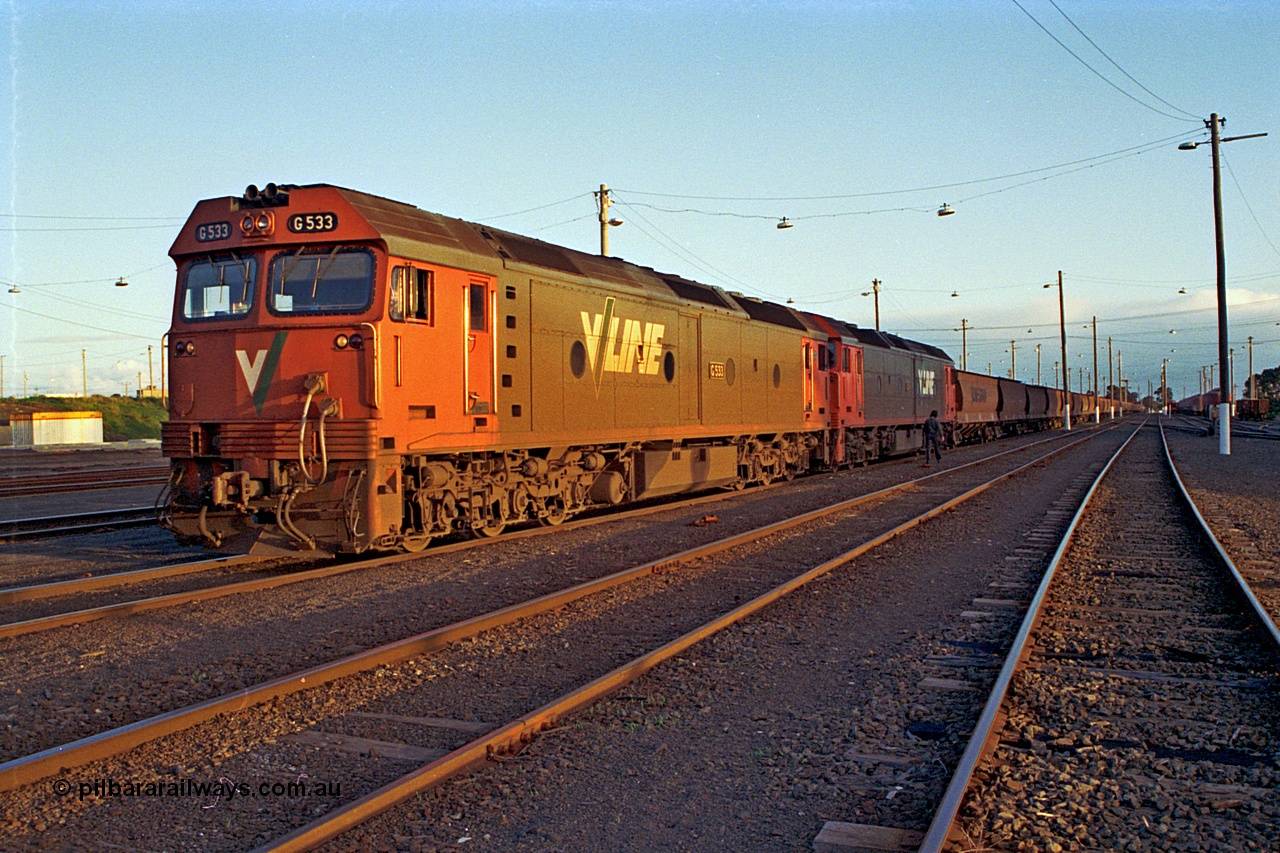 185-33
North Geelong Yard, V/Line pair of G class, G 533 Clyde Engineering EMD model JT26C-2SS serial 88-1263 and a sister conduct their brake test prior to departure with down empty grain train 9125.
Keywords: G-class;G533;Clyde-Engineering-Somerton-Victoria;EMD;JT26C-2SS;88-1263;