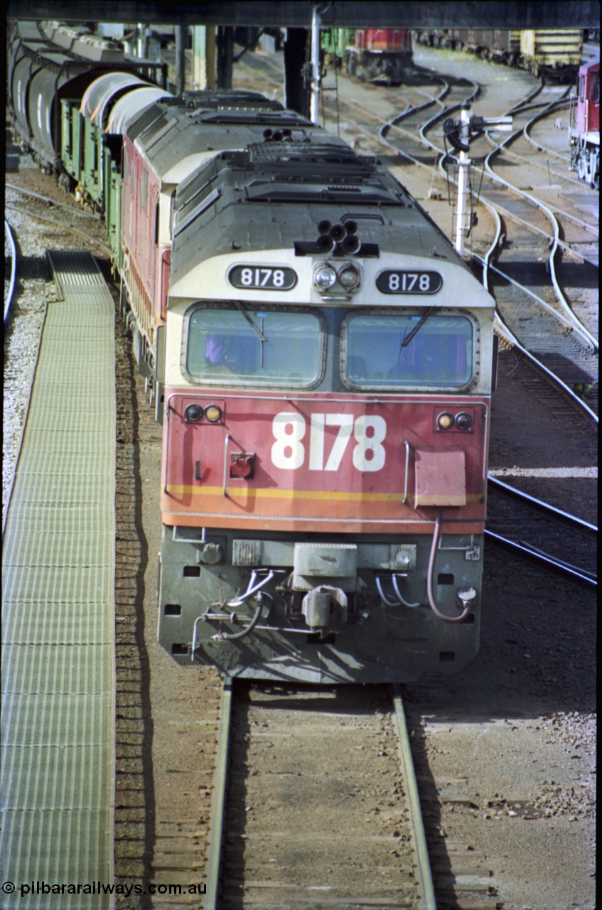 189-28
Albury yard view, double NSWSRA 81 class locomotives 8178 Clyde Engineering EMD model JT26C-2SS serial 85-1097 and 8170 wearing the candy livery on the point of an Victorian bound goods train, cab front vertical view.
Keywords: 81-class;8178;Clyde-Engineering-Kelso-NSW;EMD;JT26C-2SS;85-1097;