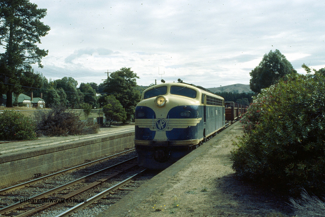 191-18
Kilmore East station platform, looking north, UP special sleeper discharge train behind Victorian Railways liveried B class B 65 Clyde Engineering EMD ML2 model serial ML2-6 glides along platform two.
Keywords: B-class;B65;Clyde-Engineering-Granville-NSW;EMD;ML2;ML2-6;bulldog