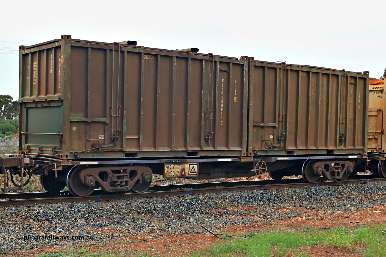 240401 4983
Kalgoorlie, Aurizon's 1029 Malcolm Freighter, waggon AQIY 00025 loaded with two 20' 25U0 type hard tops, BISU 100043[0] and BISU 100021[3]. The AQIY were originally built as the CQYY but CFCLA did not buy them, Bradken then stored them as KQYY. When Aurizon bought them they had the handbrake relocated to the middle of the waggon from the end. 1st of April 2024.
Keywords: AQIY-type;AQIY00025;Bradken;CQYY-type;KQYY-type;