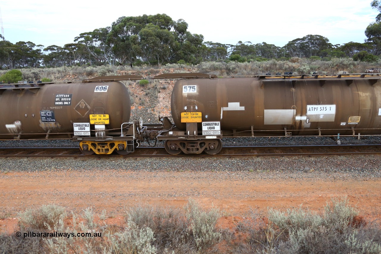 161116 5104
West Kalgoorlie, Shell fuel train 3442, tank waggon ATPF 606, built by Westrail Midland Workshops 1982 for Shell as type WJP 80.66 kL one compartment one dome. Shows type F InterLock couplers between ATPF 606 and ATPF 575.
Keywords: ATPF-type;ATPF606;Westrail-Midland-WS;WJP-type;