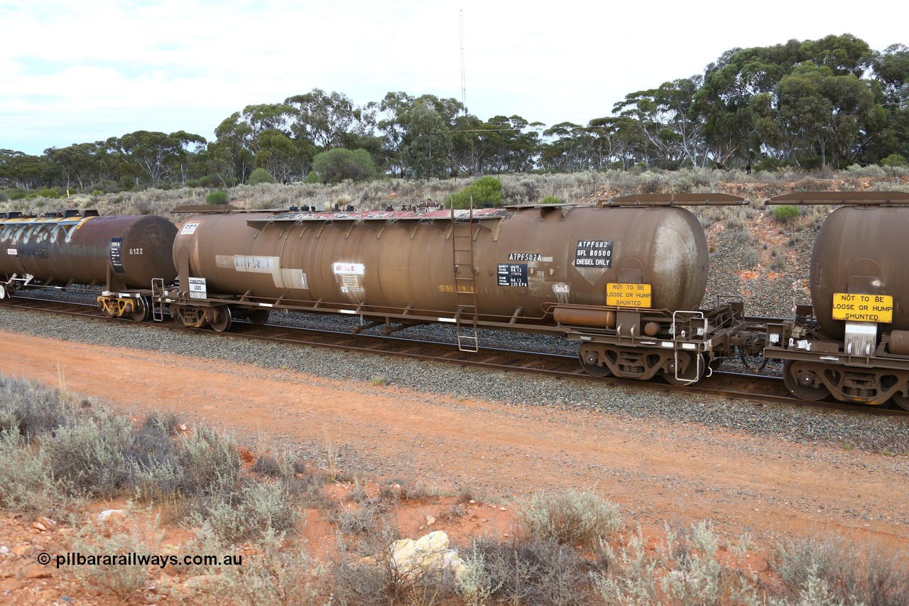 161116 5105
West Kalgoorlie, Shell fuel train 3442, ATPF type tank waggon ATPF 582, built by WAGR Midland Workshops 1976 for Shell as type WJP 80.66 kL one compartment one dome, original fleet no. 694 visible, but 717 has been written near walkway. Converted to narrow gauge 1986 and recoded JPC.
Keywords: ATPF-type;ATPF582;WAGR-Midland-WS;WJP-type;JPC-type;