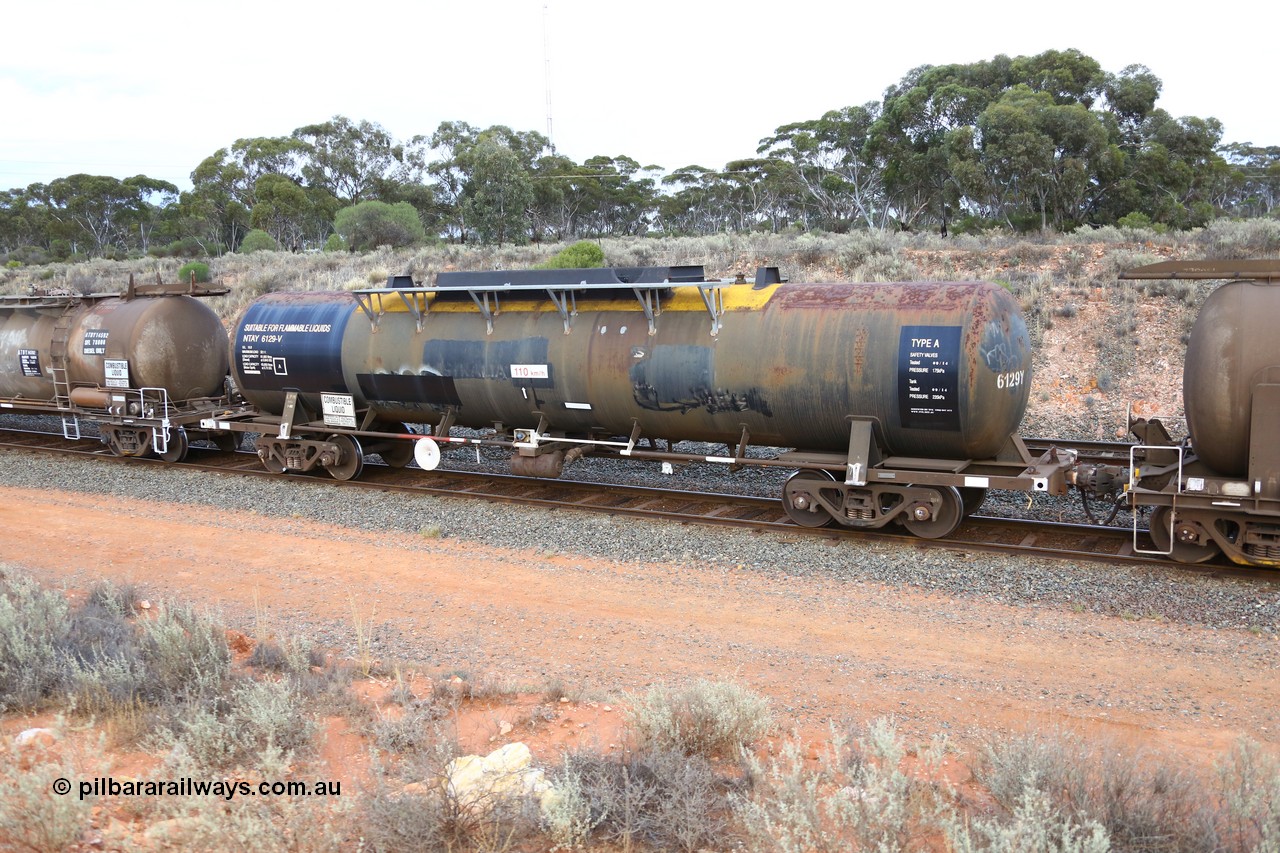 161116 5108
West Kalgoorlie, Shell fuel train 3442, NTAY type tank waggon NTAY 6129, built by Industrial Engineering Qld in 1976 as an SCA type SCA 280 for Shell. Recoded to NTAF 280, then 6129, capacity of 61,300 litres, former owner lettering for Freight Australia visible, note normal E type coupler, ATPF has type F InterLock.
Keywords: NTAY-type;NTAY6129;Indeng-Qld;SCA-type;SCA280;NTAF-type;