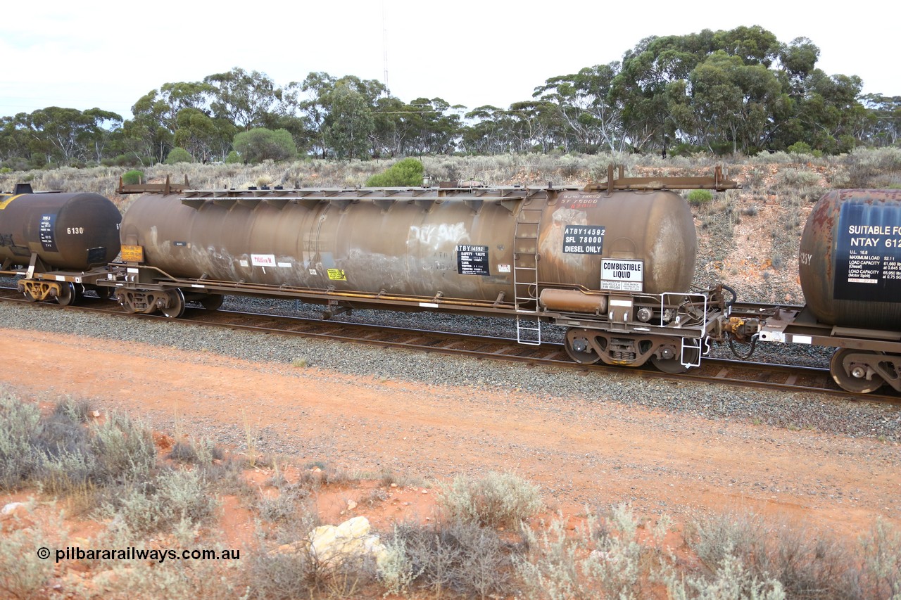 161116 5109
West Kalgoorlie, Shell fuel train 3442, tank waggon ATBY 14592, built by Westrail Midland Workshops 1981 for Bain Leasing as type JPB, 82 kL, on narrow gauge as JPBA, then SG WJPB, still visible on the roof, note vacuum brake pipe and type F InterLock coupler, also Westrail still visible on the side.
Keywords: ATBY-type;ATBY14592;Westrail-Midland-WS;JPB-type;JPBA-type;WJPB-type;