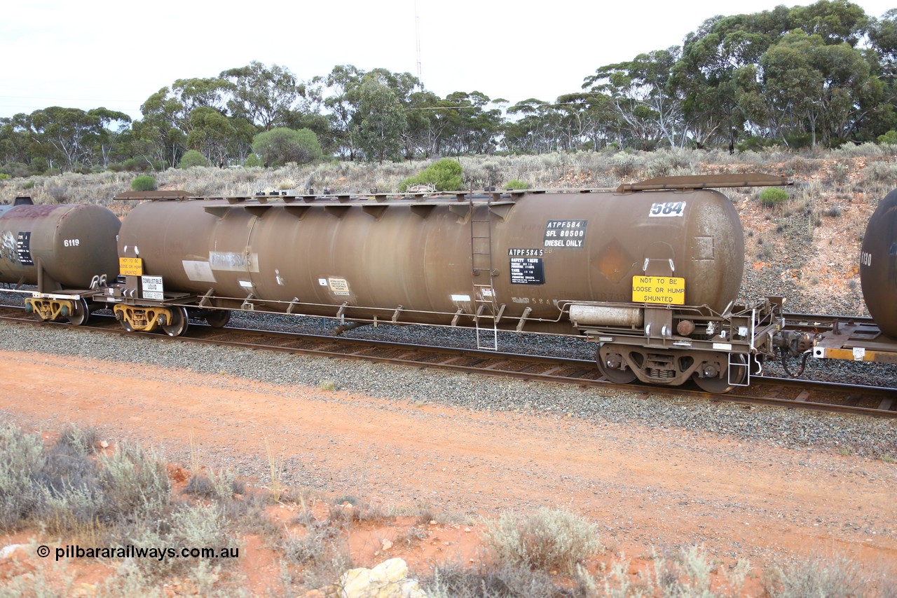 161116 5112
West Kalgoorlie, Shell fuel train 3442, tank waggon ATPF 584, built by Westrail Midland Workshops 1980 as the final Shell WJP type 80.66 kL one compartment one dome. Shell fleet no. TR719 still visible, fitted with type F InterLock couplers.
Keywords: ATPF-type;ATPF584;Westrail-Midland-WS;WJP-type;