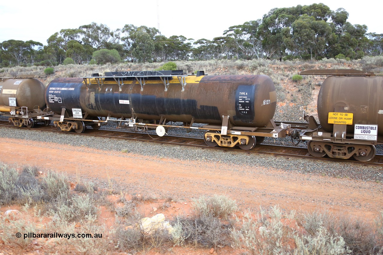 161116 5117
West Kalgoorlie, Shell fuel train 3442, tank waggon NTAY 6127, built by Indeng Qld 1976 for Shell as type SCA 278, then NTAF 278 with normal couplers.
Keywords: NTAY-type;NTAY6127;Indeng-Qld;SCA-type;SCA278;NTAF-type;