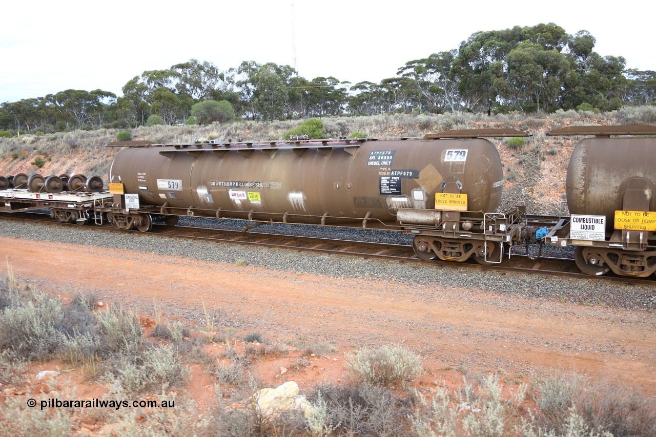 161116 5126
West Kalgoorlie, Shell fuel train 3442, ATPF 579 fuel tank waggon built by WAGR Midland Workshops 1974 for Shell as WJP type 80.66 kL one compartment one dome, fitted with type F InterLock couplers.
Keywords: ATPF-type;ATPF579;WAGR-Midland-WS;WJP-type;