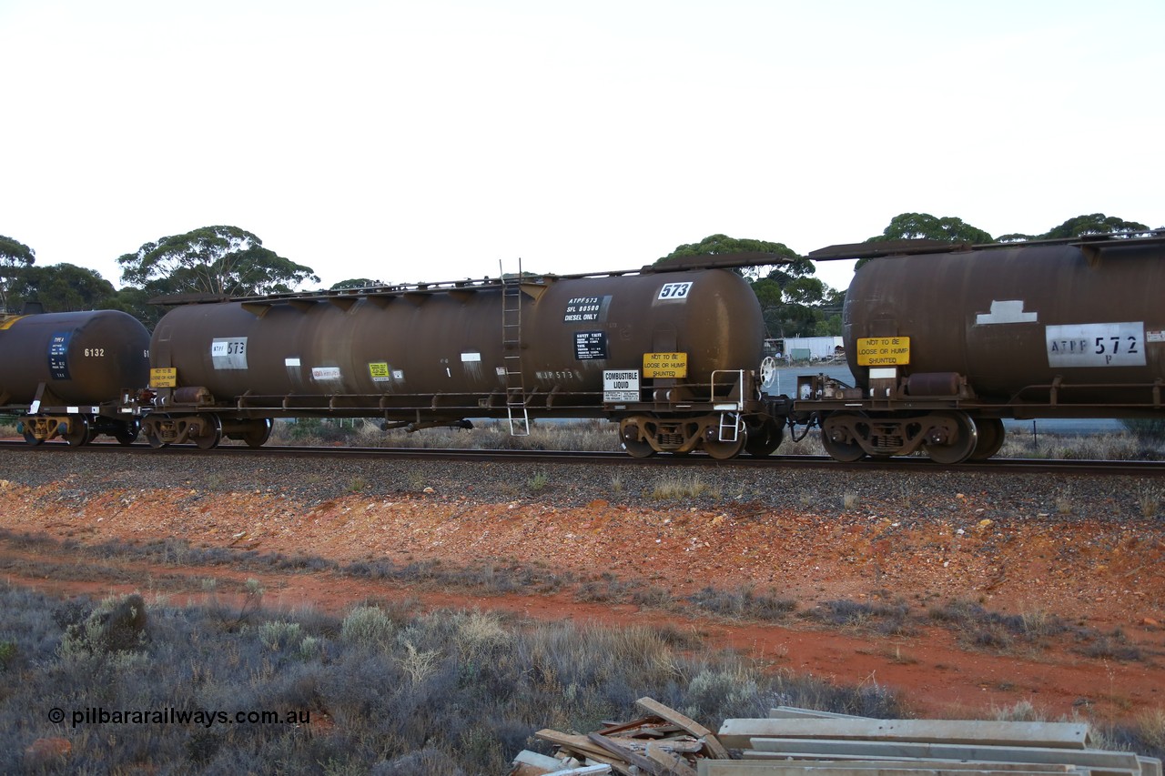 161116 5551
Binduli, empty Shell fuel train 4443, ATPF 573 fuel tank waggon built by WAGR Midland Workshops 1974 for Shell as WJP type 80.66 kL one compartment one dome, capacity of 80500 litres, Shell Fleet No. 708, old code still visible, fitted with type F InterLock couplers.
Keywords: ATPF-type;ATPF573;WAGR-Midland-WS;WJP-type;