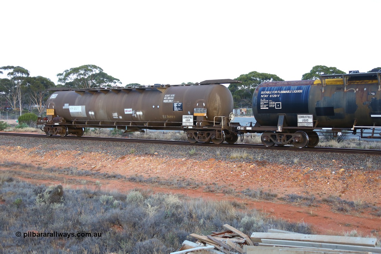 161116 5564
Binduli, empty Shell fuel train 4443, tank waggon ATPF 575, built by WAGR Midland Workshops 1974 for Shell as type WJP 80.66 kL one compartment one dome. 
Keywords: ATPF-type;ATPF575;WAGR-Midland-WS;WJP-type;