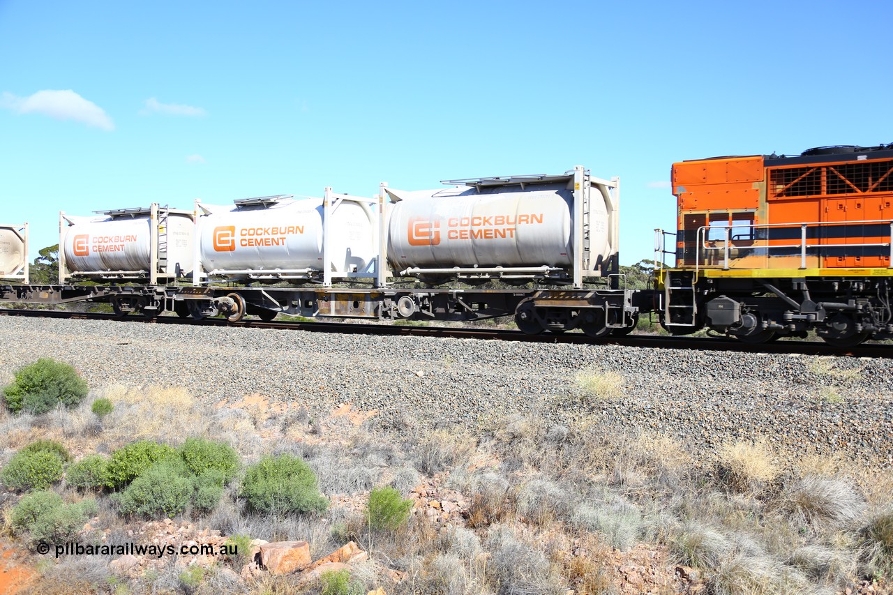 161111 2454
Binduli, Kalgoorlie Freighter train 5025, waggon AQHY 30096 loaded with two Cockburn Cement ITVU type 20' tanktainers IVTU 274016[1] and 274009[5]. AQHY 30096 originally built by the WAGR Midland Workshops in 1964/66 as a WF type flat waggon, then in 1997, following several recodes and modifications, was one of seventy five waggons converted to the WQH type to carry CSA sulphuric acid tanks between Hampton/Kalgoorlie and Perth/Kwinana.
Keywords: AQHY-type;AQHY30096;WAGR-Midland-WS;WF-type;WFDY-type;WFDF-type;RFDF-type;WQH-type;