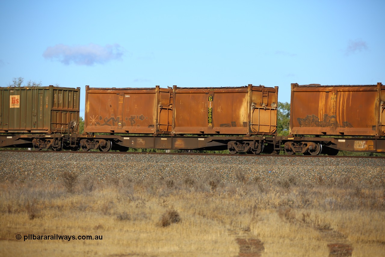 161111 2406
Kalgoorlie, Malcolm freighter train 5029, waggon AQNY 32196 one of sixty two waggons built by Goninan WA in 1998 as WQN type for Murrin Murrin container traffic with two original style sulphur containers both with original style doors and sliding tarpaulin tops. The numbers are graffitied out, G 969 and G 857.
Keywords: AQNY-type;AQNY32196;Goninan-WA;WQN-type;