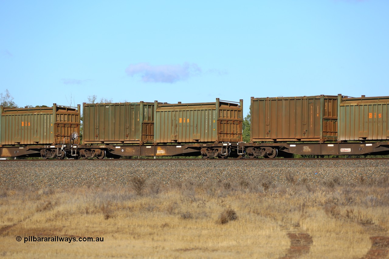 161111 2427
Kalgoorlie, Malcolm freighter train 5029, waggon AQNY 32156 one of sixty two waggons built by Goninan WA in 1998 as WQN type for Murrin Murrin container traffic with a Bis Industries roll-top 55UA type sulphur container SBIU 200605 and an undecorated Bis Industries hard-top 25U0 type sulphur container BISU 100065.
Keywords: AQNY-type;AQNY32156;Goninan-WA;WQN-type;