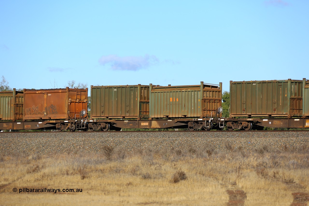 161111 2428
Kalgoorlie, Malcolm freighter train 5029, waggon AQNY 32160 one of sixty two waggons built by Goninan WA in 1998 as WQN type for Murrin Murrin container traffic with a Bis Industries roll-top 55UA type sulphur container SBIU 200601 and an undecorated Bis Industries hard-top 25U0 type sulphur container BISU 100015.
Keywords: AQNY-type;AQNY32160;Goninan-WA;WQN-type;