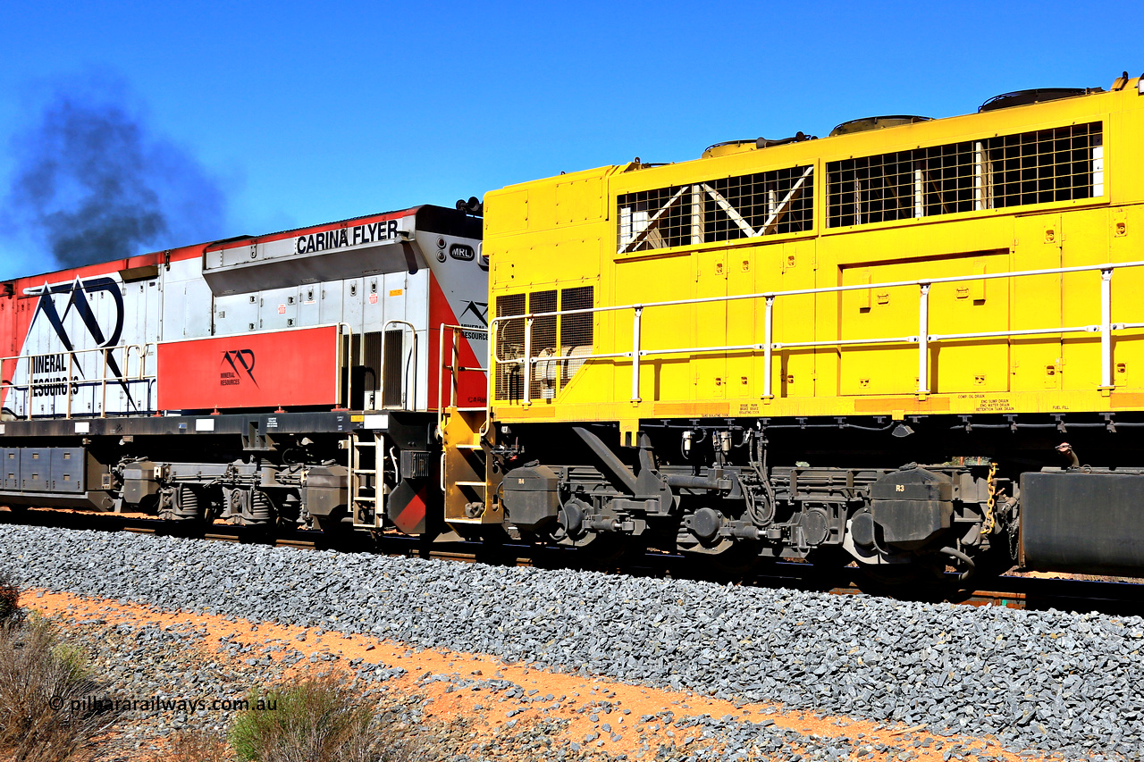 240328 2906
Feysville, Mineral Resources empty Mount Walton iron ore train 5040 with mid-train units Q 4003 and MRL 005 'Carina Flyer' view of the differing radiator sections on the EMD GT46C [Q 4003] and the GE C44ACi [MRL 005]. March 28, 2024.
Keywords: Q-class;Q4003;Clyde-Engineering-Forrestfield-WA;EMD;GT46C;97-1456;Q303;