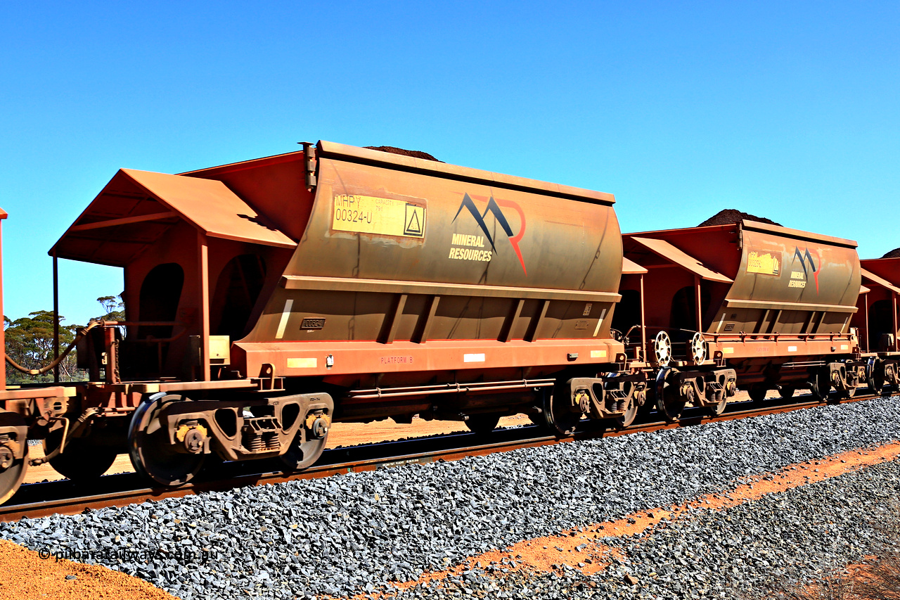 240328 2978
Loaded Koolyanobbing iron ore train 5041 with Mineral Resources Ltd MHPY type iron ore waggons MHPY 00324 and MHPY 00323 built by CSR Yangtze Co China with serial numbers 2014 / 382-324 and 2014 / 382-323 in 2014 as a batch of 382 pairs, these bottom discharge hopper waggons are operated in 'married' pairs. March 28, 2024.
Keywords: MHPY-type;MHPY00324;2014/382-324;MHPY00323;2014/382-323;CSR-Yangtze-Rolling-Stock-Co-China;