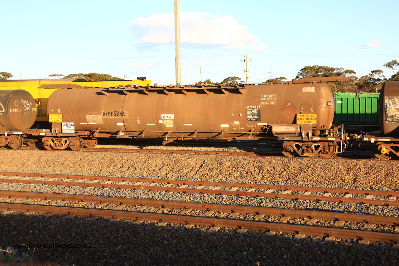 240328 3174
West Kalgoorlie, Viva Energy's ATPF 584 fuel tank waggon, built by Westrail Midland Workshops in 1980 as the final Shell WJP type 80.66 kL one compartment one dome tank. Original code and Shell Fleet No. TR 719 still visible, fitted with type F InterLock couplers, 80,500 SFL [safe fill level], on Pacific National's train 5445 empty fuel to Esperance. March 28, 2024.
Keywords: ATPF-type;ATPF584;Westrail-Midland-WS;WJP-type;