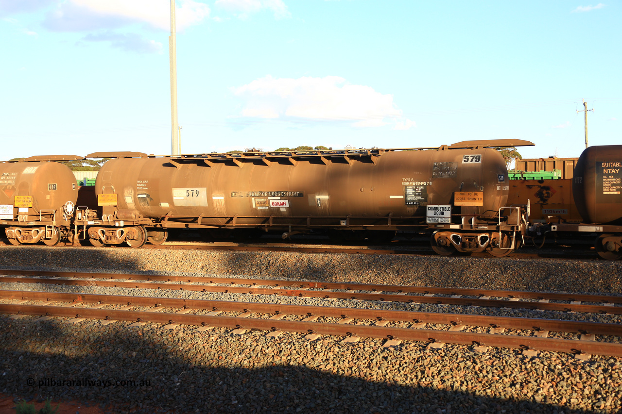 240328 3180
West Kalgoorlie, Viva Energy's APTF type fuel tank waggon ATPF 579 built by WAGR Midland Workshops in 1974 for Shell, in a batch of nine, as a WJP type 80,660 litre, one compartment one dome tank waggon, with a SFL of 80,500 litres, fitted with type F InterLock couplers. Pacific National empty fuel train 5445 to Esperance. March 28, 2024.
Keywords: ATPF-type;ATPF579;WAGR-Midland-WS;WJP-type;