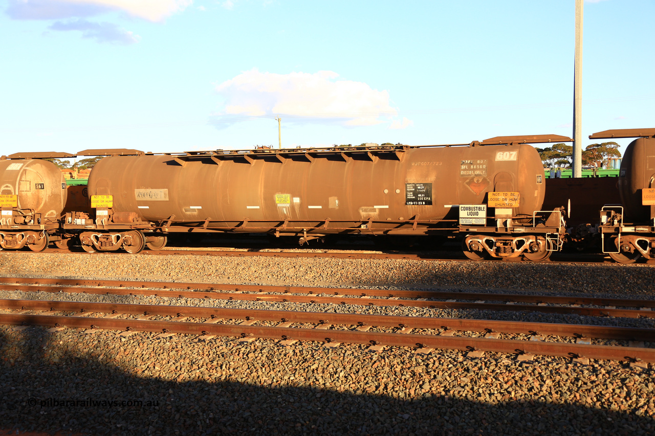 240328 3181
West Kalgoorlie, Viva Energy's APTF type fuel tank waggon ATPF 607 built by Westrail Midland Workshops in 1982 for Shell, in a batch of two, as a WJP type, 80,660 litre, one compartment one dome, with a SFL of 80,500 litres, fitted with type F InterLock couplers. Pacific National empty fuel train 5445 to Esperance. March 28, 2024.
Keywords: ATPF-type;ATPF607;Westrail-Midland-WS;WJP-type;