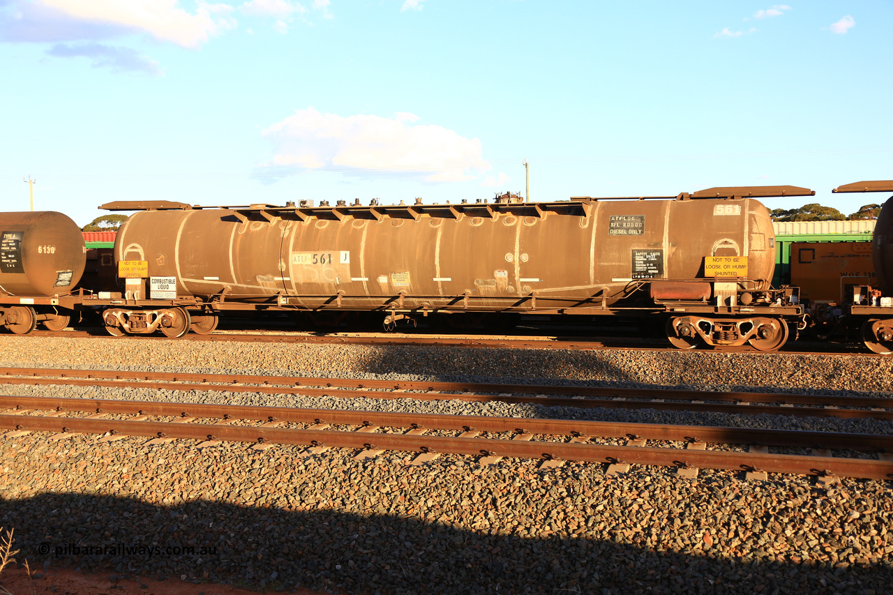 240328 3182
West Kalgoorlie, Viva Energy's ATLF type fuel tank waggon ATLF 561, built by WAGR Midland Workshops 1973 for Shell, in a batch of two, as type WJL with 86,490 litre capacity, one compartment one dome, fitted with type F InterLock couplers and a safe fill level of 80,500 litres. Pacific National empty fuel train 5445 to Esperance. March 28, 2024.
Keywords: ATLF-type;ATLF561;WAGR-Midland-WS;WJL-type;