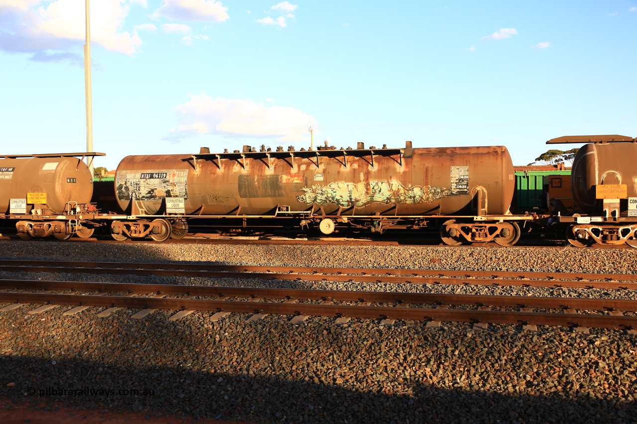 240328 3185
West Kalgoorlie, Viva Energy's NTBF type fuel tank waggon NTBF 6119, with a leading zero added, originally built by Comeng NSW in 1975 as SCA type SCA 270 a 69,000 litre bitumen tanker for Shell NSW, diesel capacity of 62,700 litres. Freight Australia painted out in middle of tank, normal E type couplers and old NTAF 6119 G number visible. Pacific National empty fuel train 5445 to Esperance. March 28, 2024.
Keywords: NTBF-type;NTBF6119;Comeng-NSW;SCA-type;SCA270;