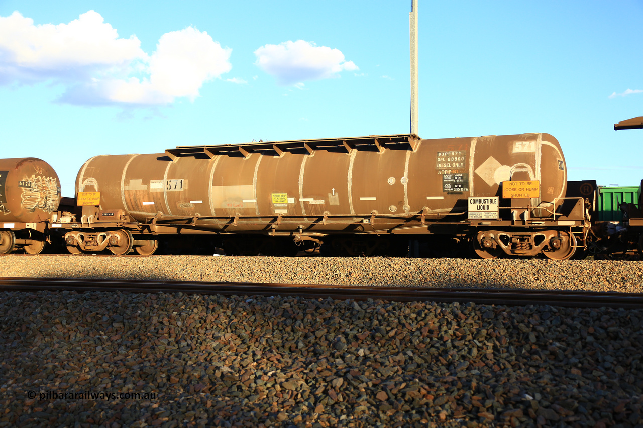 240328 3196
West Kalgoorlie, Viva Energy's APTF type fuel tank waggon ATPF 571, class leader, built by WAGR Midland Workshops in 1974 for Shell, in a batch of nine, as a WJP type 80,660 litre, one compartment one dome tank waggon, with a SFL of 80,500 litres, fitted with type F InterLock couplers. Pacific National empty fuel train 5445 to Esperance. March 28, 2024.
Keywords: ATPF-type;ATPF571;WAGR-Midland-WS;WJP-type;