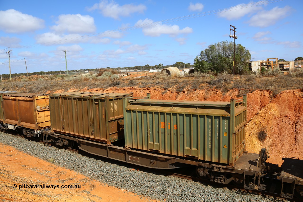 161112 3031
West Kalgoorlie, loaded Malcolm sulphur train 6029, AQNY type waggon AQNY 32175 one of sixty two waggons built by Goninan WA in 1998 as WQN type for Murrin Murrin container traffic with a Bis Industries roll-top type UA55 container SBIU 200626 and an un-decaled hard-top type 25U0 container BISU 100057.
Keywords: AQNY-type;AQNY32175;Goninan-WA;WQN-type;