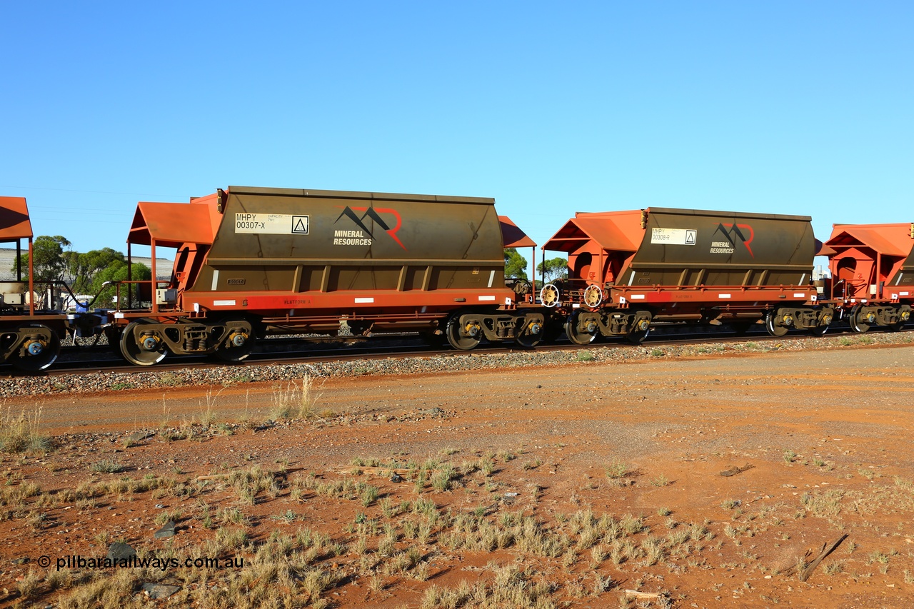 190107 0435
Parkeston, Mineral Resources Ltd MHPY type iron ore waggon married pair set MHPY 00307 and MHPY 00308 built by CSR Yangtze Co China in 2014 as a batch of 382 units, these bottom discharge hopper waggons are operated in 'married' pairs.
Keywords: MHPY-type;MHPY00307;2014/382-307;CSR-Yangtze-Rolling-Stock-Co-China;
