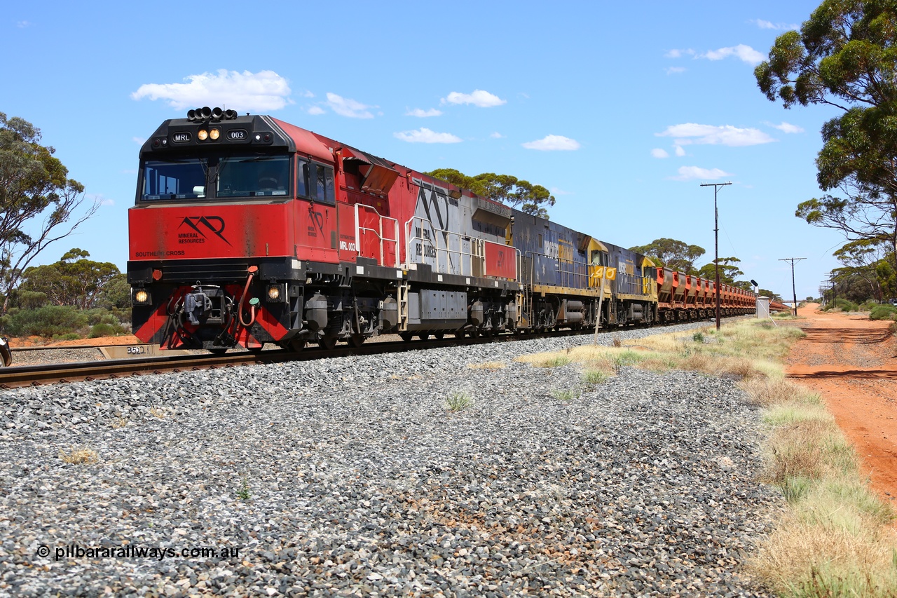 190107 0524
Binduli, following a crew change Mineral Resources empty iron ore train 2034 with Mineral Resources MRL class loco MRL 003 'Southern Cross' with serial R-0113-03/14-506 a UGL Rail Broadmeadow NSW built GE model C44ACi model leads two Pacific National NR class units NR 43 and NR 78 with 53 pairs of MHPYs and 2 single MHLY bottom discharge hopper waggons for 1293 metres and 2258 tonnes.
Keywords: MRL-class;MRL003;UGL-Rail-NSW;GE;C44ACi;R-0113-03/14-506;
