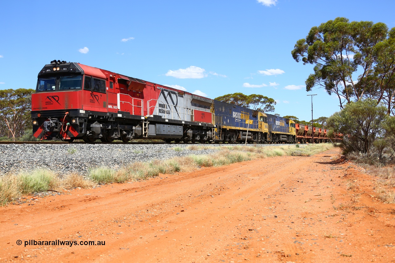 190107 0528
Binduli, following a crew change Mineral Resources empty iron ore train 2034 with Mineral Resources MRL class loco MRL 003 'Southern Cross' with serial R-0113-03/14-506 a UGL Rail Broadmeadow NSW built GE model C44ACi model leads two Pacific National NR class units NR 43 and NR 78 with 53 pairs of MHPYs and 2 single MHLY bottom discharge hopper waggons for 1293 metres and 2258 tonnes.
Keywords: MRL-class;MRL003;UGL-Rail-NSW;GE;C44ACi;R-0113-03/14-506;