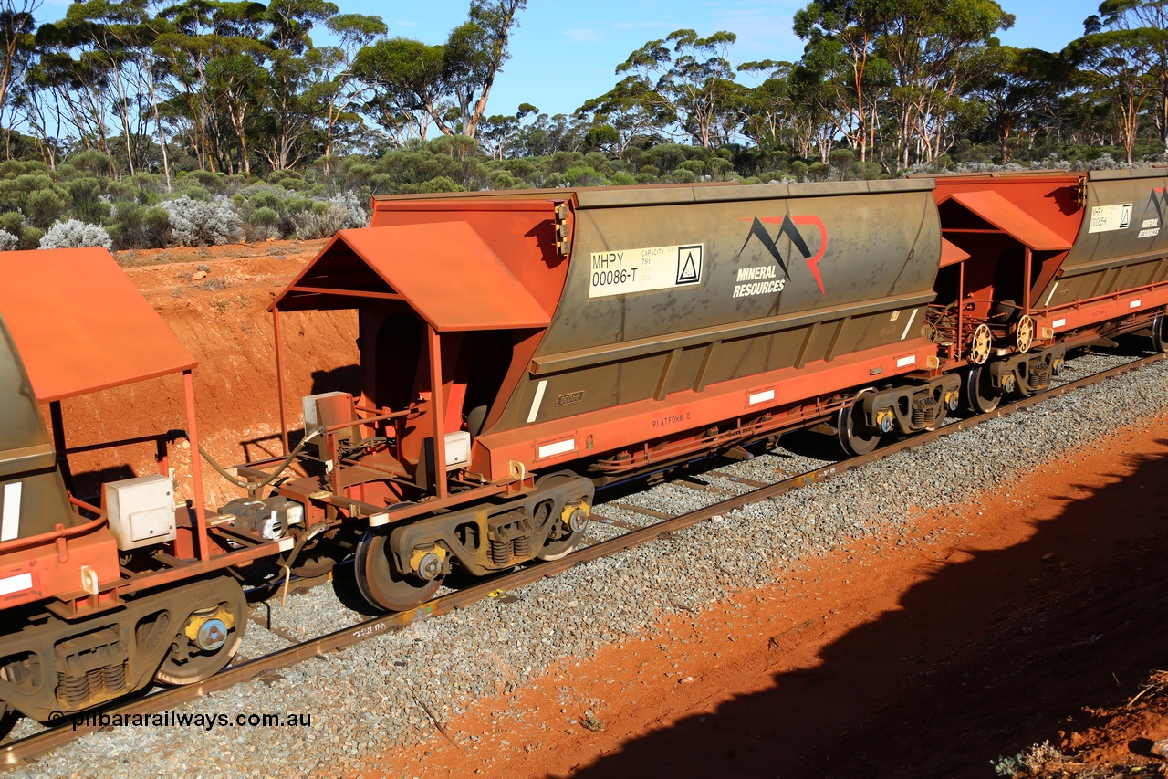 190109 1569
Binduli, Mineral Resources Ltd empty iron ore train 4030 with MRL's MHPY type iron ore waggon MHPY 00085 built by CSR Yangtze Co China serial 2014/382-85 in 2014 as a batch of 382 units, these bottom discharge hopper waggons are operated in 'married' pairs.
Keywords: MHPY-type;MHPY00086;2014/382-86;CSR-Yangtze-Rolling-Stock-Co-China;