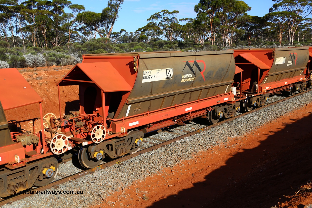 190109 1590
Binduli, Mineral Resources Ltd empty iron ore train 4030 with MRL's MHPY type iron ore waggon MHPY 00374 built by CSR Yangtze Co China serial 2014/382-374 in 2014 as a batch of 382 units, these bottom discharge hopper waggons are operated in 'married' pairs.
Keywords: MHPY-type;MHPY00374;2014/382-374;CSR-Yangtze-Rolling-Stock-Co-China;