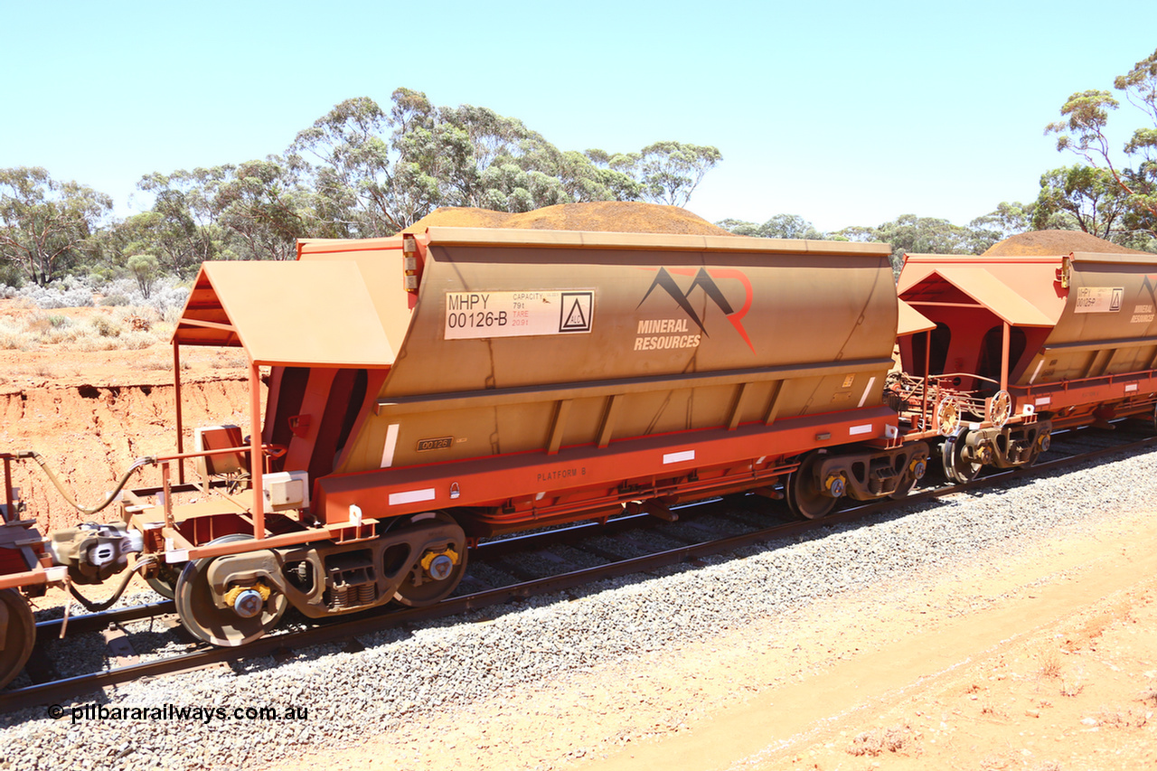 190129 4233
Binduli, on Mineral Resources Ltd loaded iron ore train service from Koolyanobbing to Esperance #3033 with MRL's MHPY type iron ore waggon MHPY 00126 built by CSR Yangtze Co China serial 2014/382-126 in 2014 as a batch of 382 units, these bottom discharge hopper waggons are operated in 'married' pairs.
Keywords: MHPY-type;MHPY00126;2014/382-126;CSR-Yangtze-Co-China;