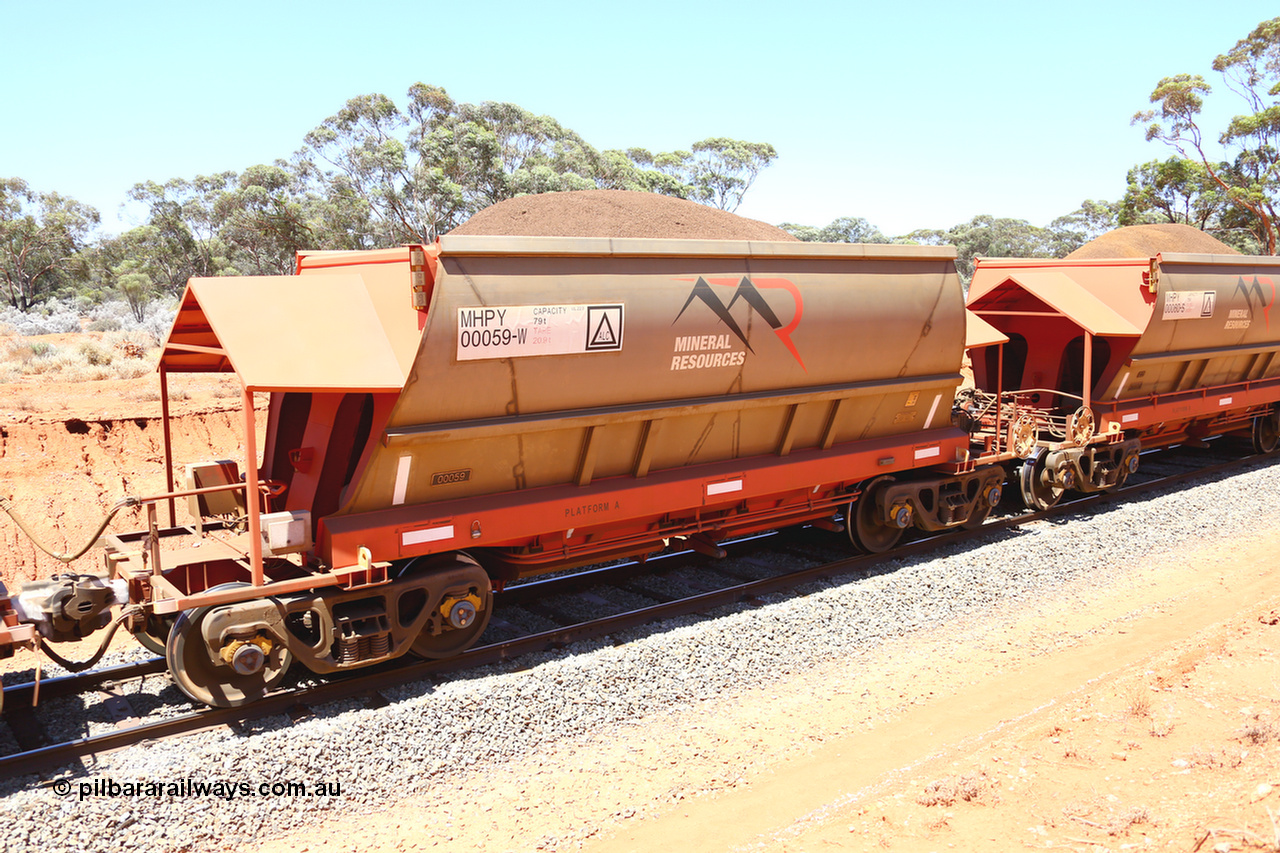 190129 4251
Binduli, on Mineral Resources Ltd loaded iron ore train service from Koolyanobbing to Esperance #3033 with MRL's MHPY type iron ore waggon MHPY 00059 built by CSR Yangtze Co China serial 2014/382-59 in 2014 as a batch of 382 units, these bottom discharge hopper waggons are operated in 'married' pairs.
Keywords: MHPY-type;MHPY00059;2014/382-59;CSR-Yangtze-Co-China;