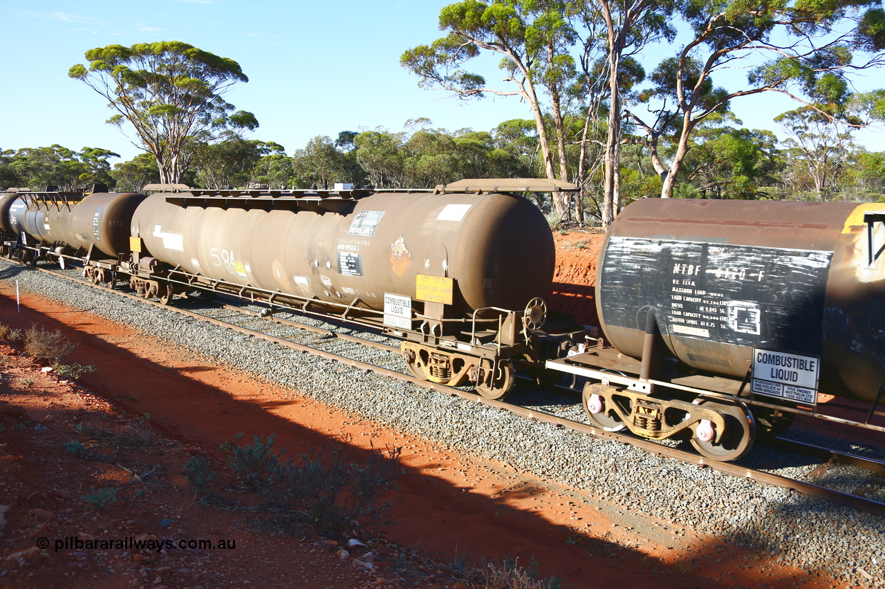 190109 1690
Binduli, empty fuel train 4445, ATPF type tank waggon ATPF 584, built by Westrail Midland Workshops 1980 for Shell as WJP type, 80.66 kL one compartment one dome, fitted with type F InterLock couplers. Under Viva Energy ownership.
Keywords: ATPF-type;ATPF584;Westrail-Midland-WS;WJP-type;