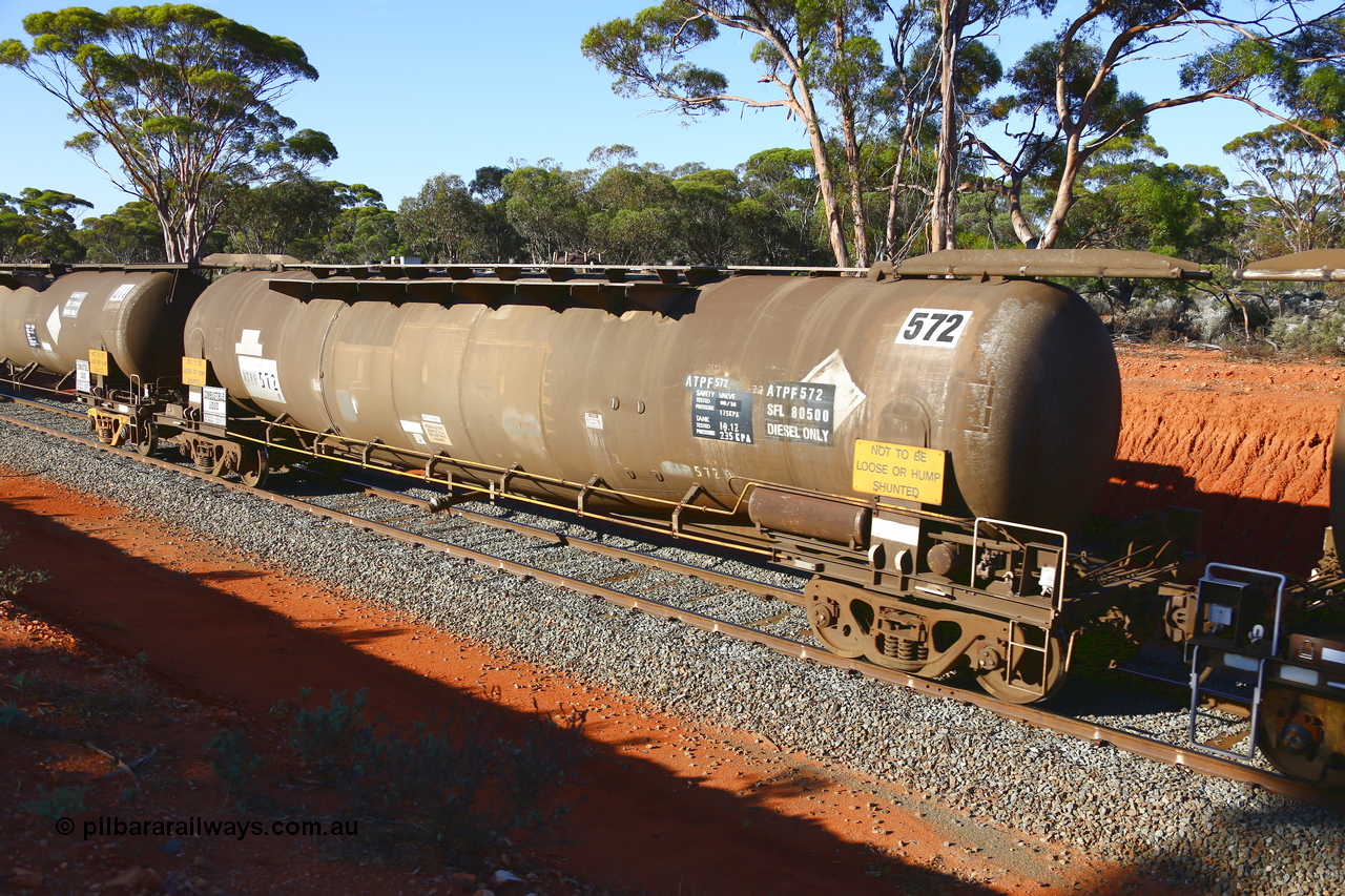 190109 1698
Binduli, empty fuel train 4445, ATPF type tank waggon ATPF 572, built by WAGR Midland Workshops 1974 for Shell as WJP type 80.66 kL one compartment one dome, old code still visible, fitted with type F InterLock couplers. Under Viva Energy ownership.
Keywords: ATPF-type;ATPF572;WAGR-Midland-WS;WJP-type;