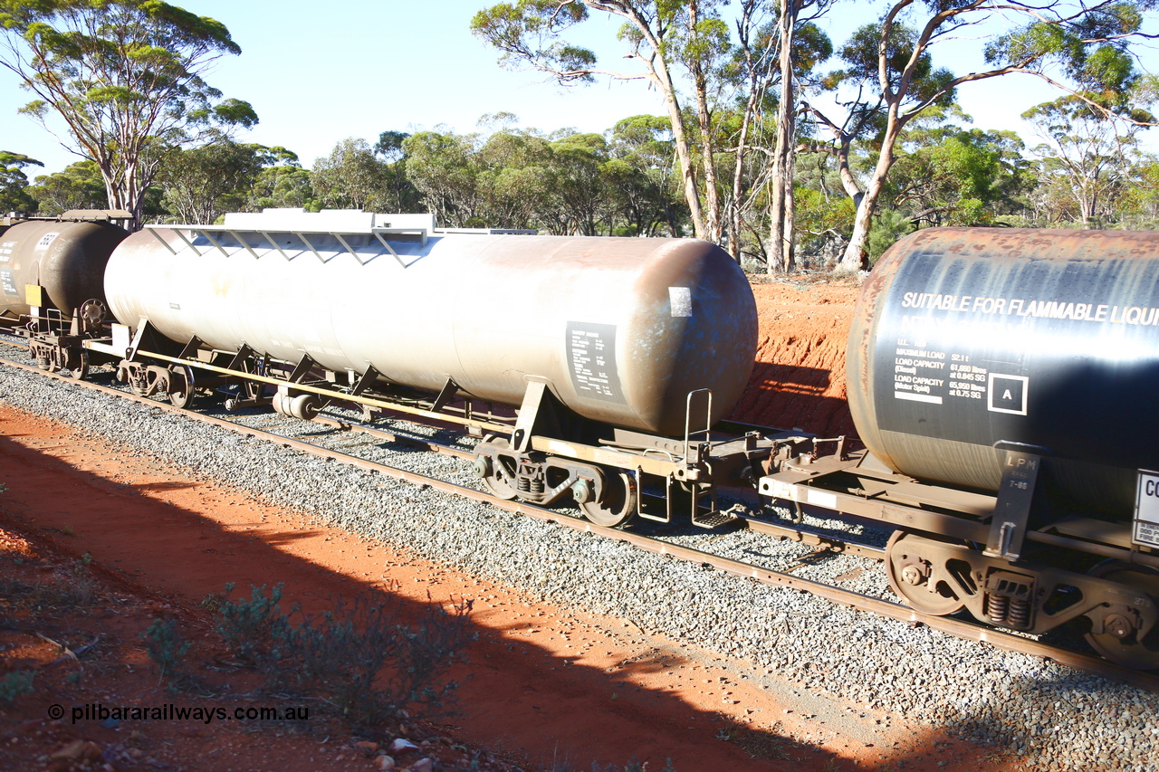 190109 1702
Binduli, empty fuel train 4445, RHTY type tank waggon RHTY 663, one of twelve such waggons built by Industrial Engineering Qld in 1976 for Victorian Railways as TWX type crude benzene tank 56,000 litres. Recoded to VTHX in 1979. After a period of storage ended up in National Rail ownership for Alice Springs traffic, now Pacific National ownership.
Keywords: RHTY-type;RHTY663;Indeng-Qld;TWX-type;VTHX-type;