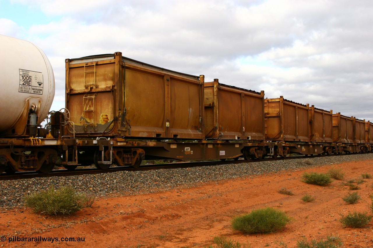 060527 4102
Scotia, AQNY 32176, one of sixty two waggons built by Goninan WA in 1998 as WQN type for Murrin Murrin container traffic, with sulphur skips S199A with original style door and modified top with tarpaulin lashed to sides, and S106L with original door and slide top tarpaulin on train 6029 loaded Malcolm freighter.
Keywords: AQNY-type;AQNY32176;Goninan-WA;WQN-type;